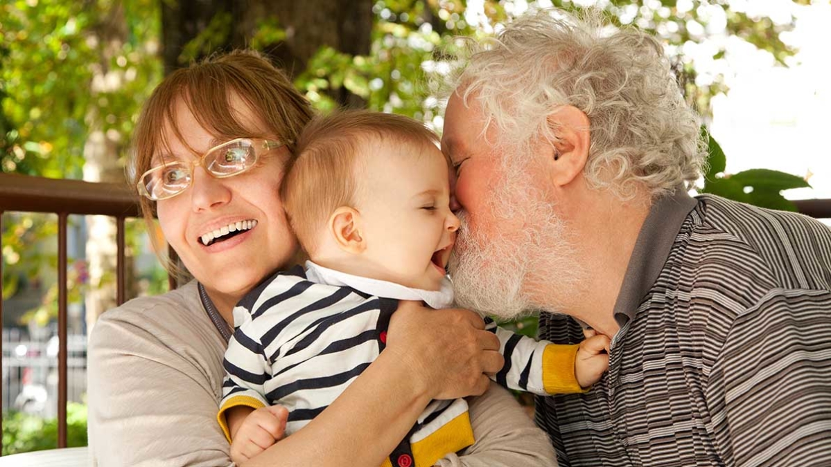 grandparents with their young grandchild