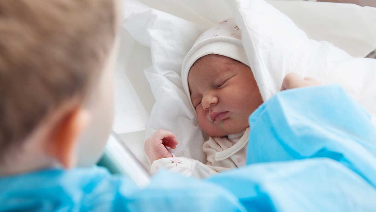 Child meeting new baby sibling