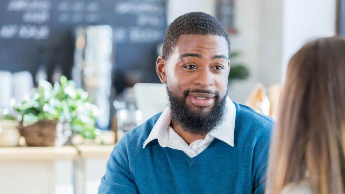 man talking to a woman