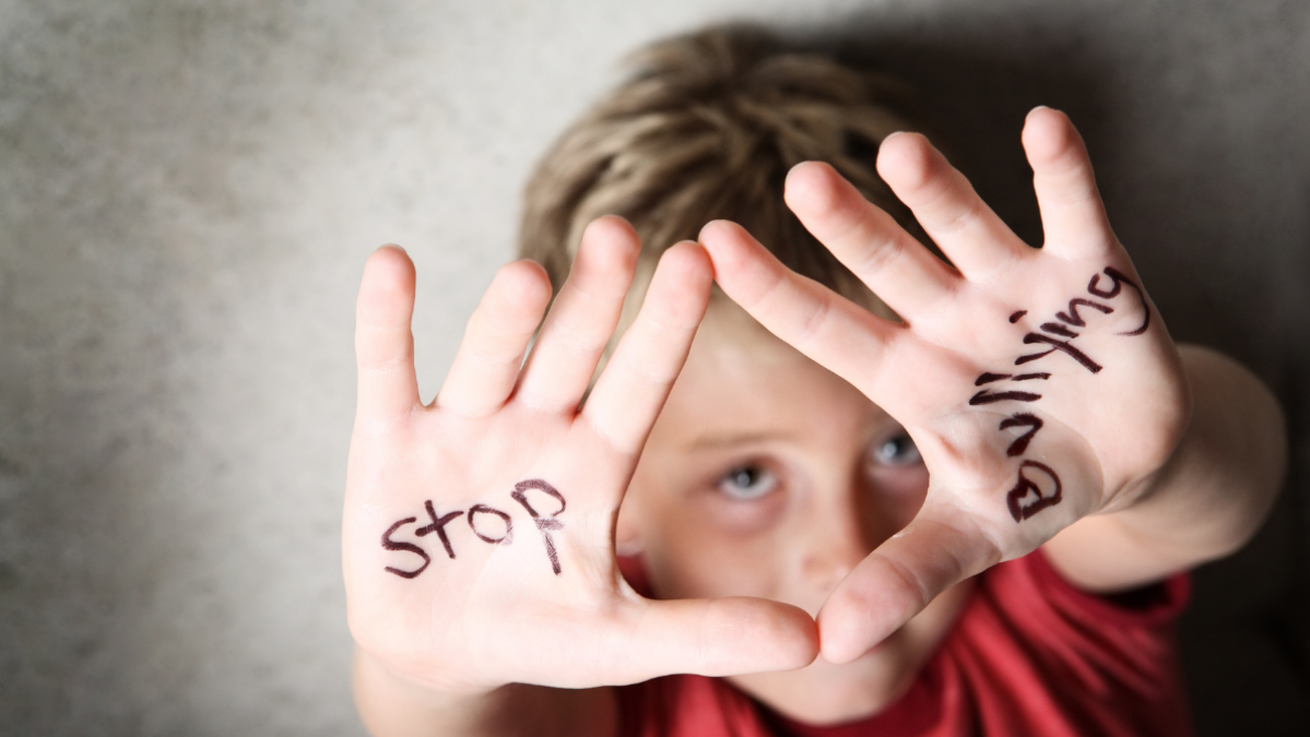 Boy with stop bullying on his hands